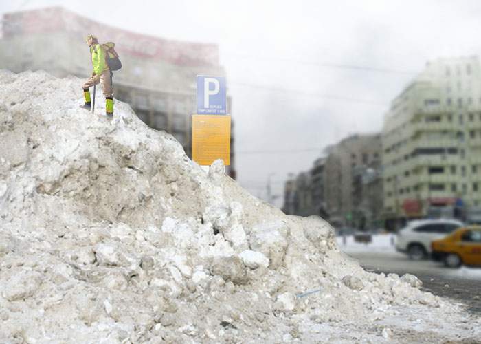 Un român căţărat pe un morman de zăpadă din staţia lui 131 spune că din vârf se vede marea